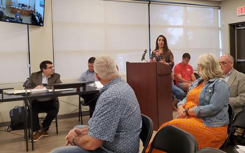 Andrea Evans shares her concerns about the added the traffic on West Jarrard Street as developer Tom Williams listens. (Photo/Samantha Sinclair)