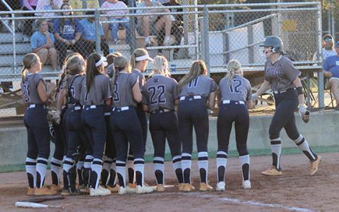 Cierra Bailey, right, is greeted by her teammates at home plate after hitting a home run in the opening game of the state series against West Laurens last week in Dexter. (Photo/Mark Turner)