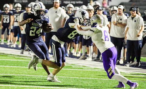 WCHS running back Noel Lammers follows a block from Cooper Adam for a big gain on a pass play during the Warriors' region matchup with Lum[kin County. (Photo/Staci Sulhoff)