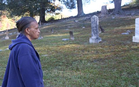Andy Allen takes it all in, admiring the restored graves in Bean Creek Cemetery. (Photo/Eric Tiongson)