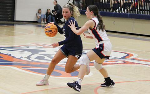 Emma Lightsey, who scored a game-high 21 points, drives past  a Habersham defender during the season opener. (Photo/Mark Turner)