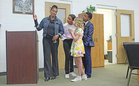 Debbie Carter-Dye and student representatives Kamiah McCullough, Ryleigh Jenkins, and Kass Brown present the new student body representative initiative to the White County Board of Education. (Photo/Hannah Caudell)