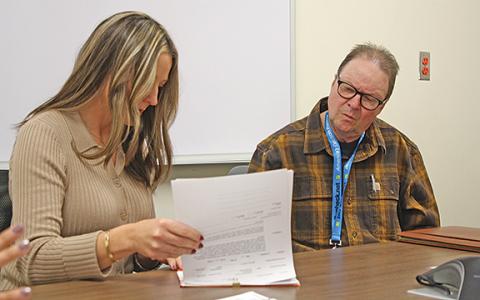 Elections Board Secretary Russell Mobley and Board Member Lorie Crumley review a ballot during the certification process. (Photo/Eric Tiongson)