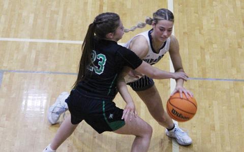 White County's Bree Burkett tries to drive past Pickens' Bella Martin during the region game.