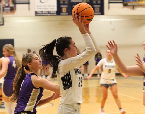 Kylie Watkins drives past Lumpkin County's Maddie Lee during the region game last Thursday in Cleveland