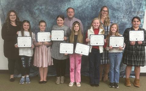 The White County Board of Education honored Mossy Creek Elementary School students who received awards during the BETA state convention in Savannah back in December. Pictured above (front row from left to right): Collins Jackson, Nora Hampton, Jooniper Montgomery, Marley Martin, Kaitley Davidson, Gwen Nash and Bethany Sanders. Back row from left to right: Kaitlin Dunn, Marc Dunn, and Jana Gossett. (Photo/Patrick Fargason)