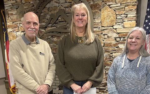 Optimist Club member and Web Developer Craig Inglis smiles for a photo with President Kathryn Vazquez and Secretary Kimberly Johnson after presenting a donation of $4,000 to the club. (Photo/submitted)