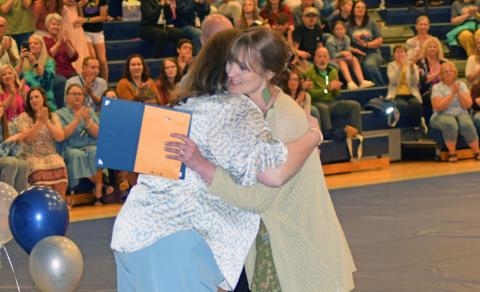Leann Fuller gets a hug from Laura Corley after being named Teacher of the Year (Photo/Jerry Grillo)