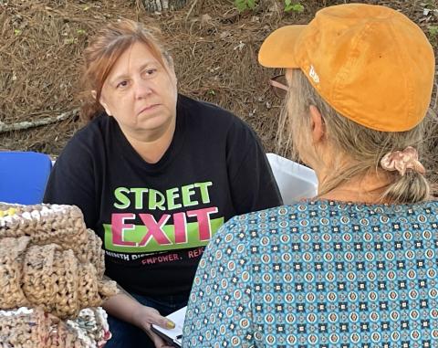 Chrystal Coker assists an unhoused client during last Thursday’s event at His Hands and Feet Ministry Thrift Store. (Photo/Jerry Grillo)