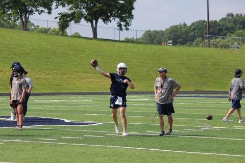 WCHS quarterback Alex Freeman rips a pass downfield durning a drill in Tuesday's workout session. (Photo/Mark Turner)