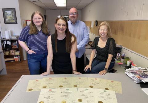 Editorial award winners (left to right) Hannah Caudell, Samantha Sinclair, Mark Turner, and Linda Erbele. (Photo/Jerry Grillo)