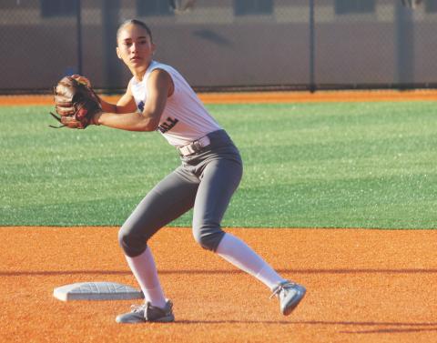 Abby Watkins makes a throw to first base during a recent practice session. (Photo/Mark Turner)  