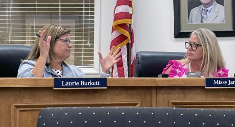 Superintendent Laurie Burkett makes her point with School Board Chair Missy Jarrard. JERRY GRILLO/WCN
