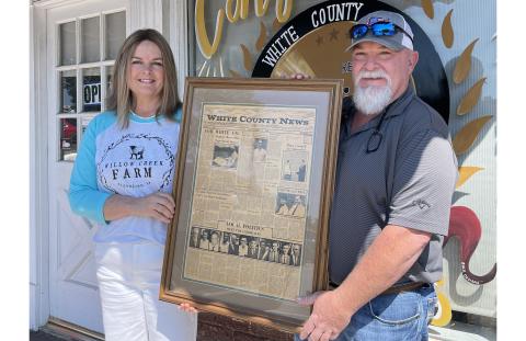 Susan Garrity and Mike McMillan display the first edition of the White County News, founded by their father, Henry McMillan. JERRY GRILLO/WCN