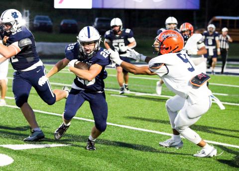 WCHS freshman running back Jack Clark tries to run past Habersham Central's Tay Spencer during the Warriors' home opener last Friday night at Warrior Stadium. The Warriors head to East Jackson this week for the final non-region game of the season.  STACI SULHOFF /WCN