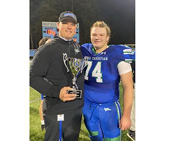 Joel Lulinski, left, and Titus Lulinski show off the GAPPS Class 2A state title trophy after LCA on the championship game in 2024. NADIA LULINSKI/SPECIAL