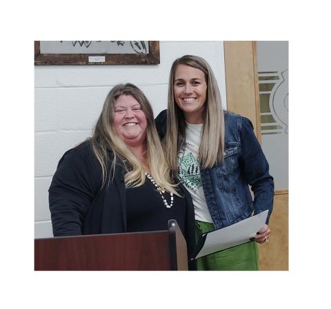 Special Education Director Michele Broadwell presented Erica Owens, a counselor at Jack P. Nix Elementary School, the Service Above Self award during a school board meeting Oct. 30. DENISE ETHERIDGE/WCN