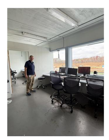 Assistant School Superintendent Jonathan Stribling points out possible repairs that could be made to the press box, should the school board approve the project.