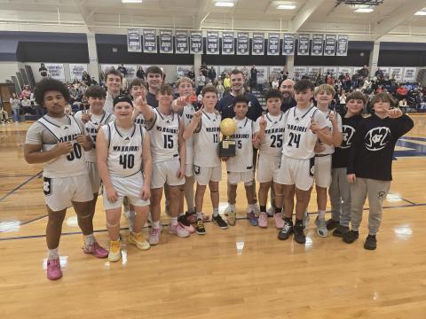 The White County Middle School Warriors show off the NGML trophy after beating Dawson County in the championship game last week at the WCMS gym. The Warriors finished the year with a 14-3 record. MARK TURNER/WCN.