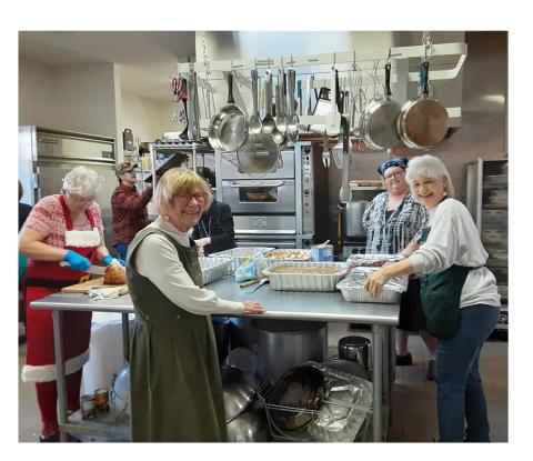 Volunteers cook a free Christmas Dinner in a past year.