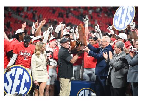UGA head coach Kirby Smart picks up some hardware after the Georgia Bulldogs rolled past Alabama last weekend in the SEC Championship game in Atlanta. KEITH BARLOW/CNI