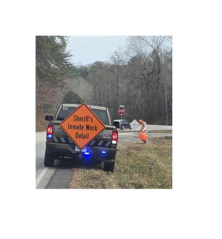 Inmates pick up trash along a county road. SUBMITTED PHOTO