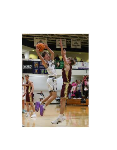 John Jarrard puts up a shot over a Dawson County defender during the region game last Friday in Cleveland.  JENNIFER KNIGHT/SPECIAL