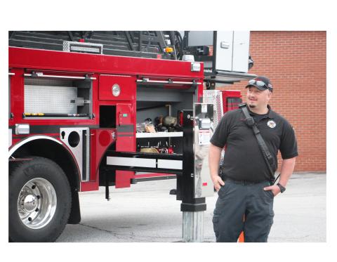 Lt. Jason Reed of the Helen Fire Department explains the ins and outs of the department’s new fire truck to students at Mountain Education’s White Campus. CARLY HENDERSON/WCN
