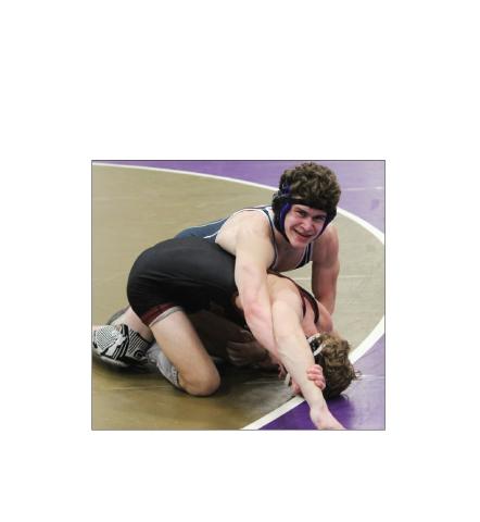 "Josh Lane flashes a smile during the final seconds of the 144-pound championship match last week at the Area 6-AAA tournament. MARK TURNER/WCN