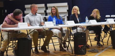 School board candidates, from left, Brad Dalton, Jordan Lee Fincher, Mary Trigg, Kim Rogers and Linda Erbele, share a moment of levity before responding to questions during an April 21 political forum. DENISE ETHERIDGE/WCN