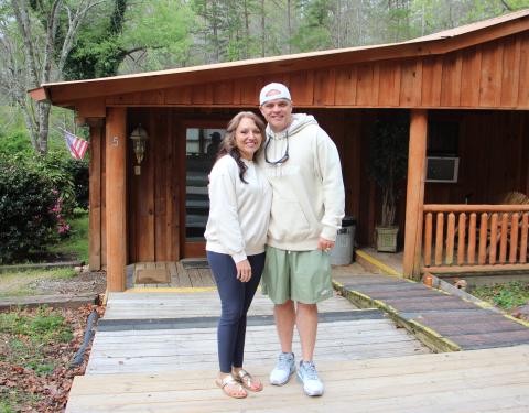Cody and Jessica Montgomery stand in front of one of five houses at Levi’s Ministries’ newly acquired Jericho House property in Sautee. CARLY HENDERSON/WCN