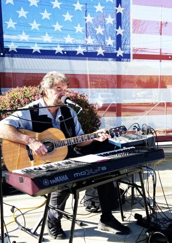Musician Kurt Johnson provides music for the Vietnam War Veterans Day observance in Freedom Park.