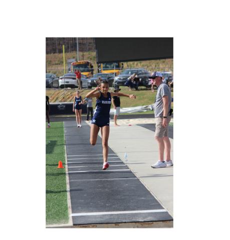 Kady McCullough won the girl's triple jump during the open day of events at the region meet. MARK TURNER/WCN