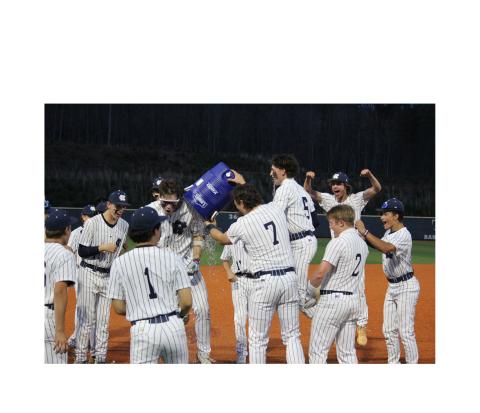 Alex Freeman, right, dumps a water cooler on Noah Thomas after Thomas gave the Warriors' a walk-off win over Lumpkin County in Game 2 of the series last Thursday in Cleveland. MARK TURNER/WCN