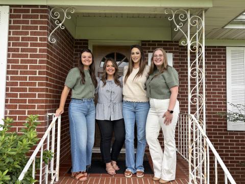 From left, Family Advocate Megan Holcombe, Family Advocate Carlyn Hearn, Forensic Interviewer Kristin Jarrard and Executive Director Victoria Dunston stand in front of South Enotah Child Advocacy Center at the meet and greet held July 22. CARLY HENDERSON/WCN