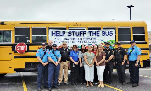 The annual Stuff the Bus school supply drive kicked off on Tuesday. From left: Cleveland Firefighter Trace Swoszowski, Cleveland Police Chief Jeff Shoemaker, Cleveland Firefighter Tim Nunnally, Deputy Chief Aaron Weiland, Capt. Donna Sims, school bus driver and trainer April Burdette, Student Support Coordinator Amanda Lammers, CPD administrative assistant Sheena Wright, School Transportation Director Sharon Hipps, Corp. Brandon Wood, Officer Perry Cook and Lt. Jared Joiner. DENISE ETHERIDGE/WCN 
