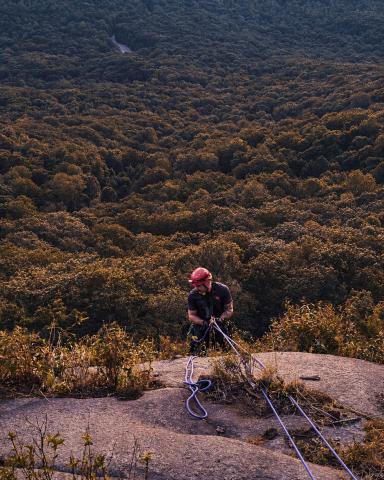 White County firefighter Will Roper rappels down the west face of Mount Yonah to reach a stranded climber Aug. 25. Roper secured the climber and assisted them to safety. SUBMITTED PHOTO 