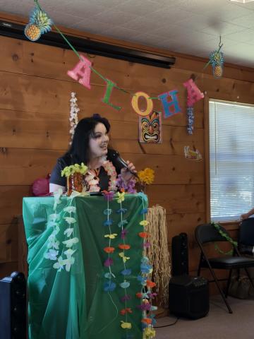 Executive Director Carly Bird welcomed people to the White County Peer Support Wellness and Respite Center’s 15th anniversary celebration. The luau included barbecue and sides, games, tours of the Center, karaoke and treats from the Kona ice truck. ERBELE/WCN