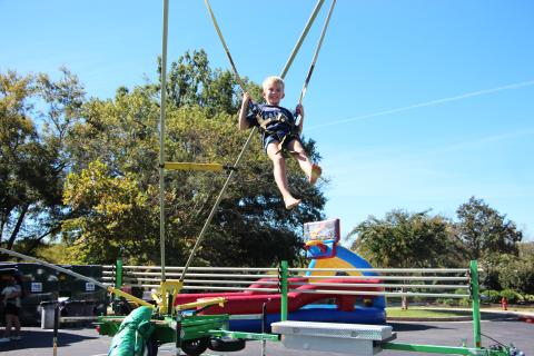 Eight-year-old Isaac jumps on a bungee during Truett McConnell's Community Fall Festival held last Saturday. CARLY HENDERSON/WCN