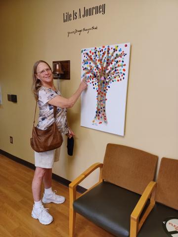 Barbara Dodson rings the bell in celebration after surgery and treatment. SUBMITTED PHOTO