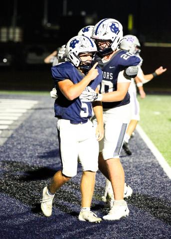 Jack Clark, left, celebrates with Jack Johnson after Clark scored the game-winning touchdown in the fourth quarter of the win over Gilmer. STACI SULHOFF/SPECIAL