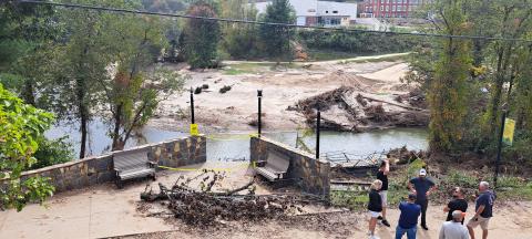 Megan Horn/The Clayton Tribune.  A walking bridge crossing the river in downtown Spruce Pine, N.C., was significantly damaged when Hurricane Helene made its way through the community. 