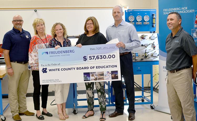 Shown from left are WCHS industrial mechanics teacher Tim Mayo, Assistant Principal Angie Helton, Principal Mary Anne Collier, White County Schools Superintendent Dr. Laurie Burkett, Gary VanWambeke (Freudenberg NOK vice president for Global Lead Center Transmission and Driveline Seals) and Wyman Hare, Cleveland plant manager for Freudenberg NOK. (Photo/Wayne Hardy)