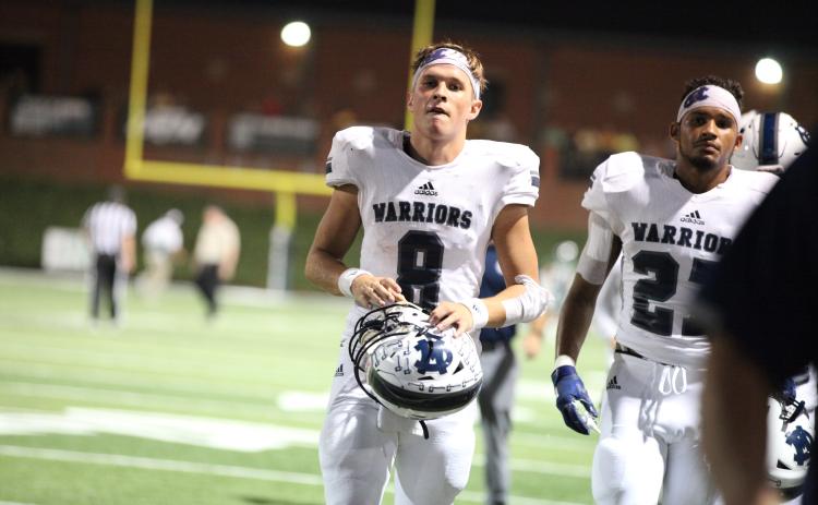 Quarterback J. Ben Haynes keyed a fourth-quarter comeback to help the Warriors erase an 11-point deficit and rally past North Hall 34-31 Friday night in Gainesville. (Photo/Staci Sulhoff)