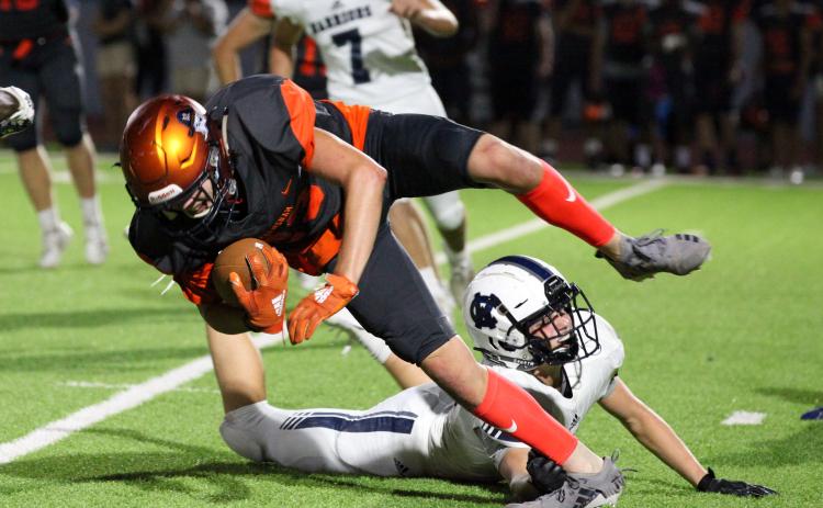 White County's Nix Burkett, trips up Habersham Central's Grayson Taylor during the Raiders' win over the Warriors last Friday night in Mt. Airy. (Photo/Staci Sulhoff)