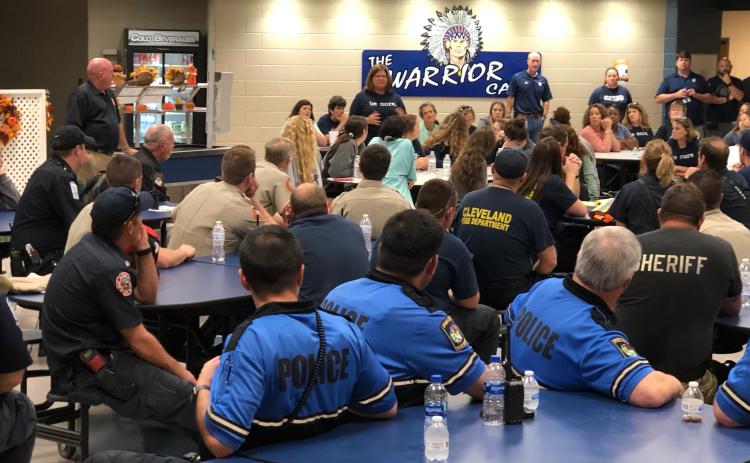 Public safety officers gather in the cafeteria of White County High School after the drill. (Photo/William Spernin)