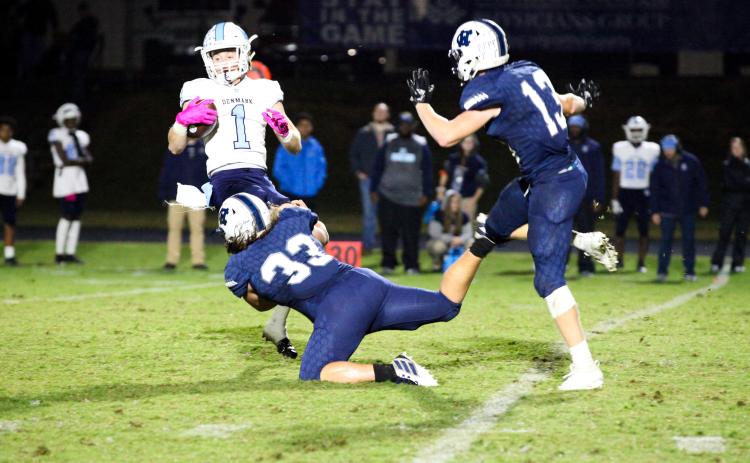 WCHS linebacker Dylan Archer, No. 33, brings down Denmark's Teddy Davenport during the region game last Friday night in Cleveland. (Photo/Staci Sulhoff)