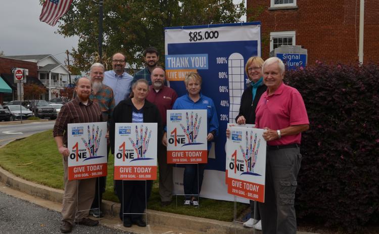 Shown from left at the Oct. 25 unveiling of a fundraising “thermometer” sign in downtown Cleveland are United Way of White County representatives Wayne Hardy, Paul Scott Abbot, Carl Free, Beth Kastner, Nathan Eason, Donald Harris, Denise Loggins, Carol Powel and Gene White. (Photo/Susan Egan)