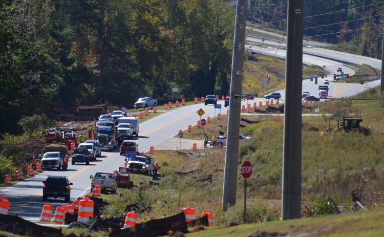 Work crews clear land Tuesday, Oct. 22, to prepare for road construction that will widen Hulsey Road in Cleveland from two lanes to five lanes, including a two-way turn lane. (Photo/Wayne Hardy)