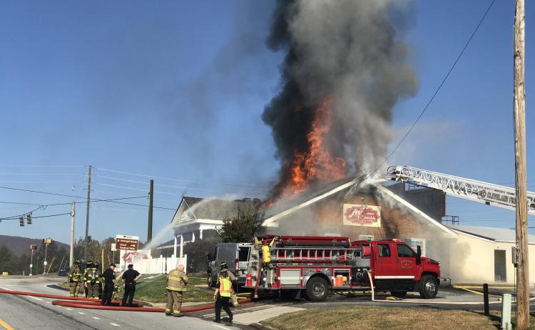 Firefighters worked for several hours on Sunday, Nov. 10, to extinguish the fire that broke out that morning at JW Reeds Tavern. (Photo/Stephanie Hill)